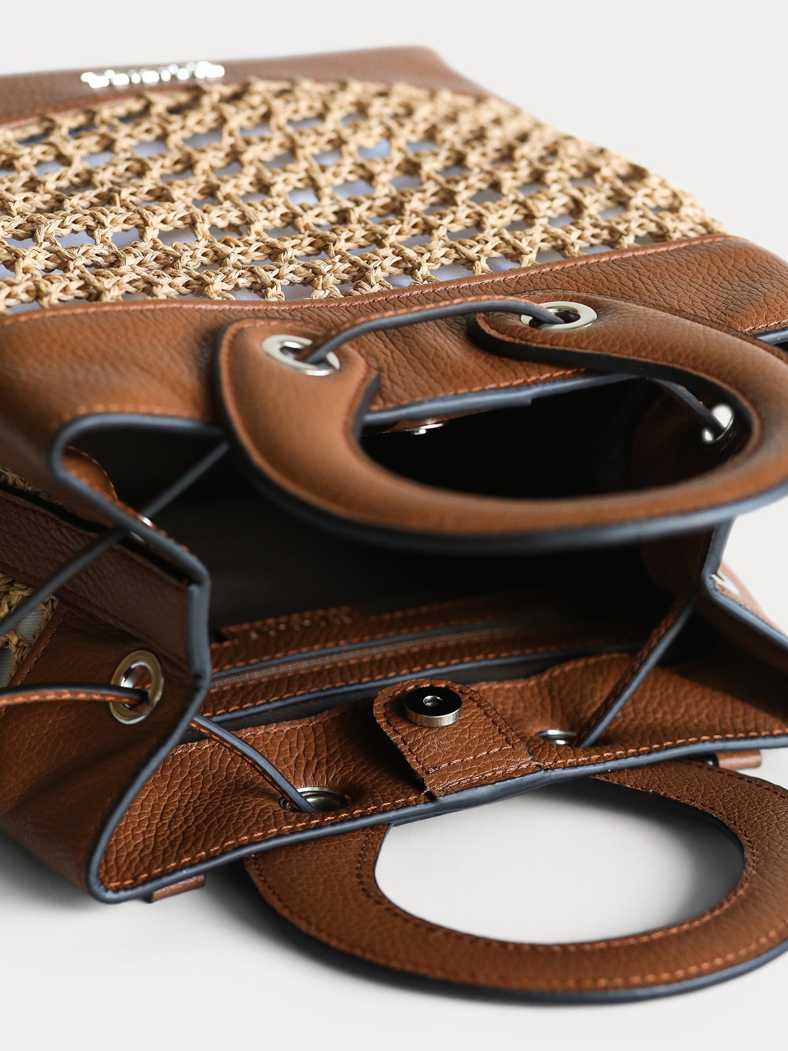 leather and paper straw bucket bag